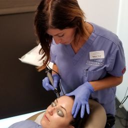 Nurse Brittany Thiele uses a Dermapen to rejuvenate a patient