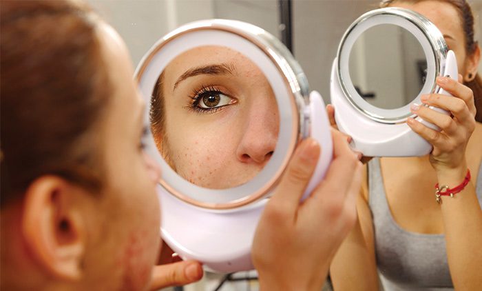 Girl looking in mirror